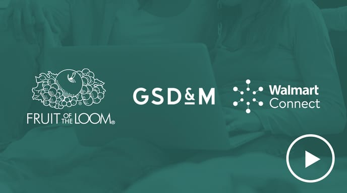 A woman and a young girl sit together using a laptop, overlaid with a green tint and the logos of Fruit of the Loom, GSD&M, and Walmart Connect, along with a play button icon.